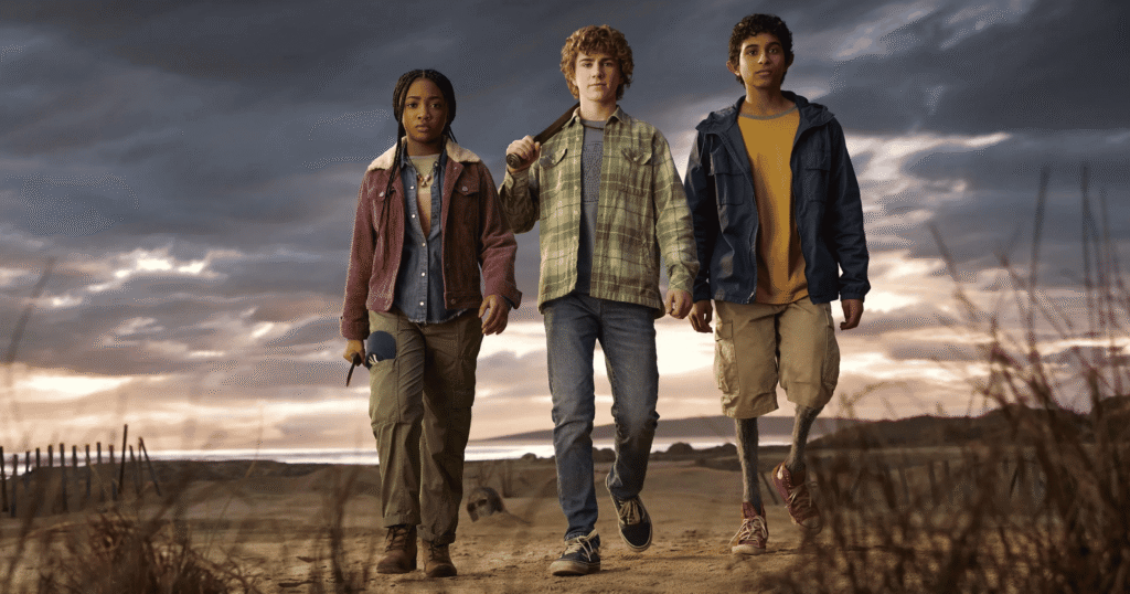 Annabeth, Percy and Grover walking towards the camera in this Percy Jackson and the Olympians still.